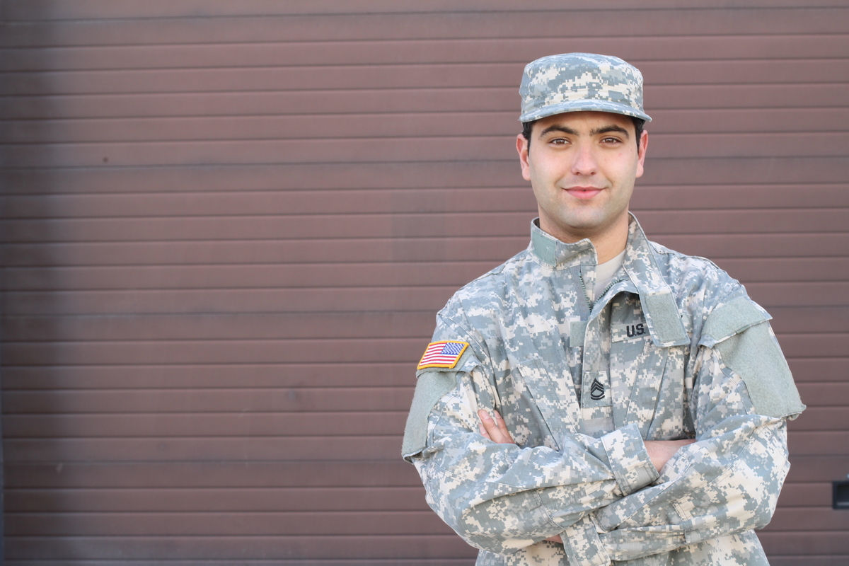 Young ethnic American soldier headshot.