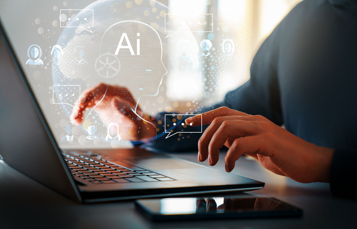 The Power and Promise of AI - image of person at laptop with abstract AI image overlaid