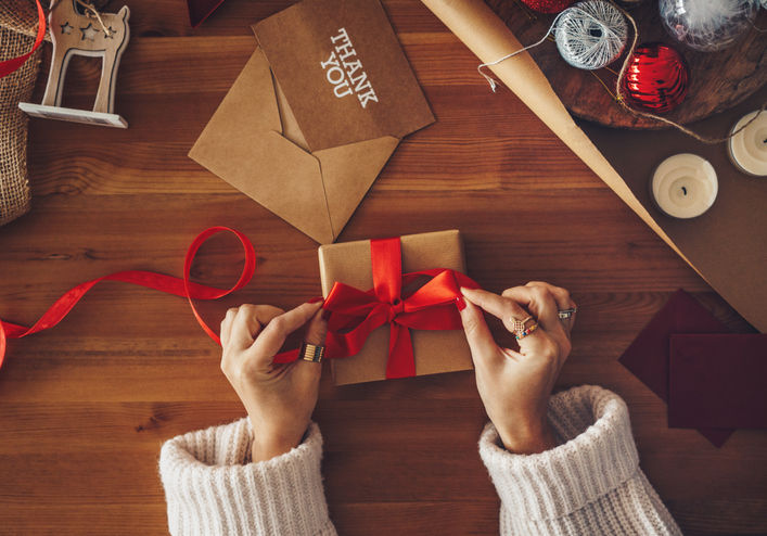 Woman wrapping Christmas gifts