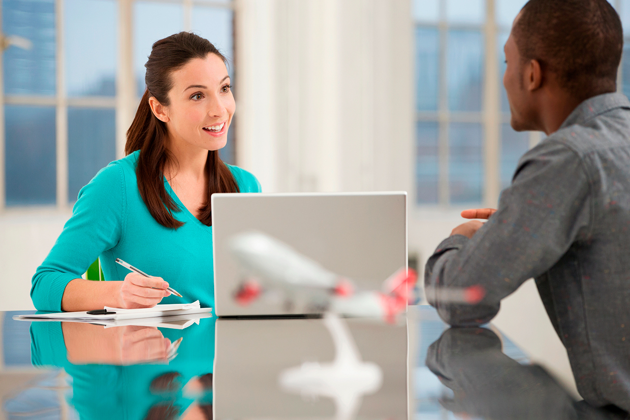 Travel agent speaking to customer