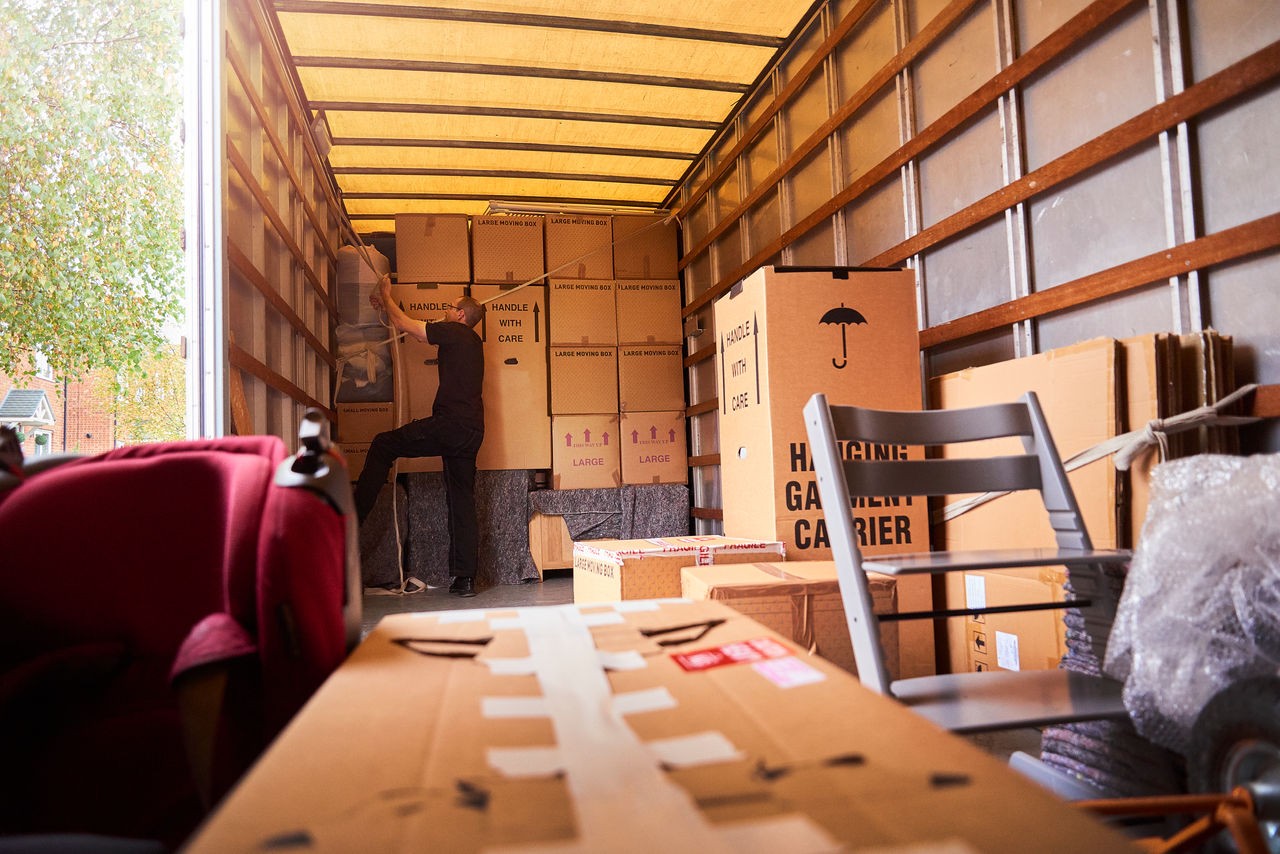 Moving company helping a family move out of their old home