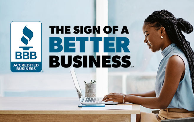 photo of woman working on laptop Sign of a Better Business in background