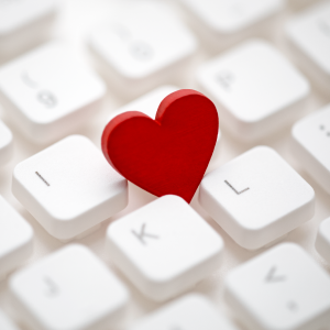 red heart shown against white keyboard