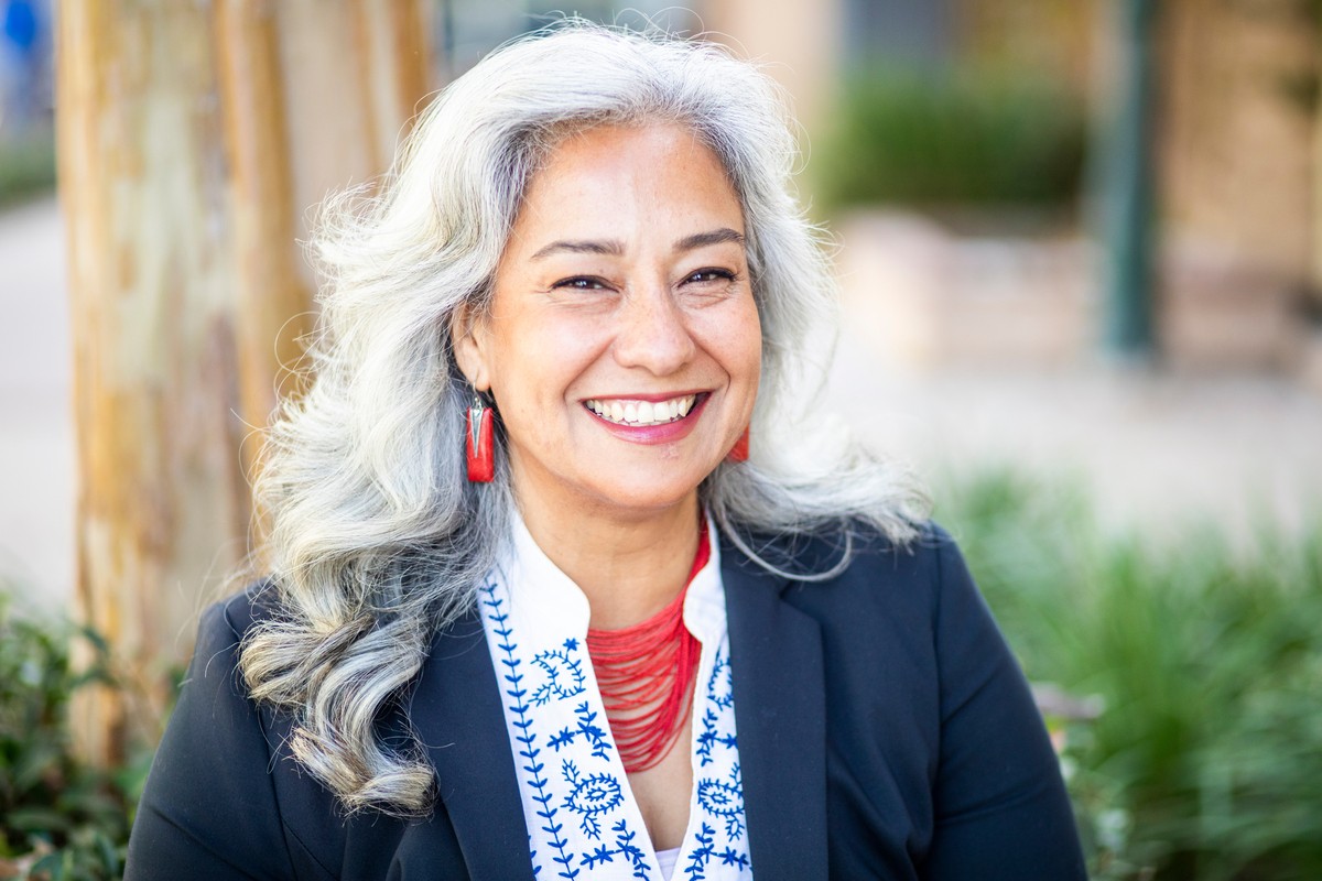 A mature Mexican businesswoman smiling