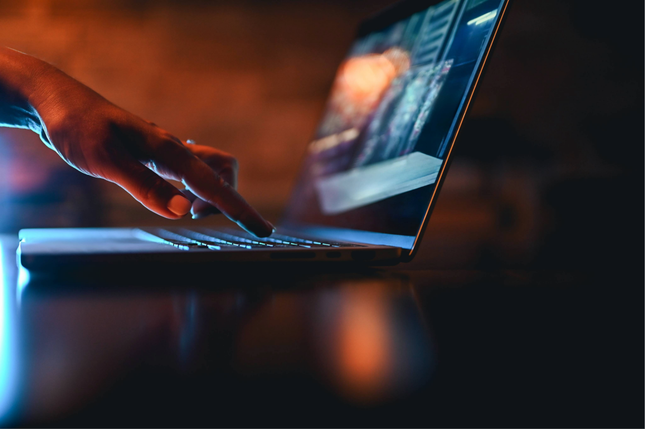 Finger on laptop keyboard