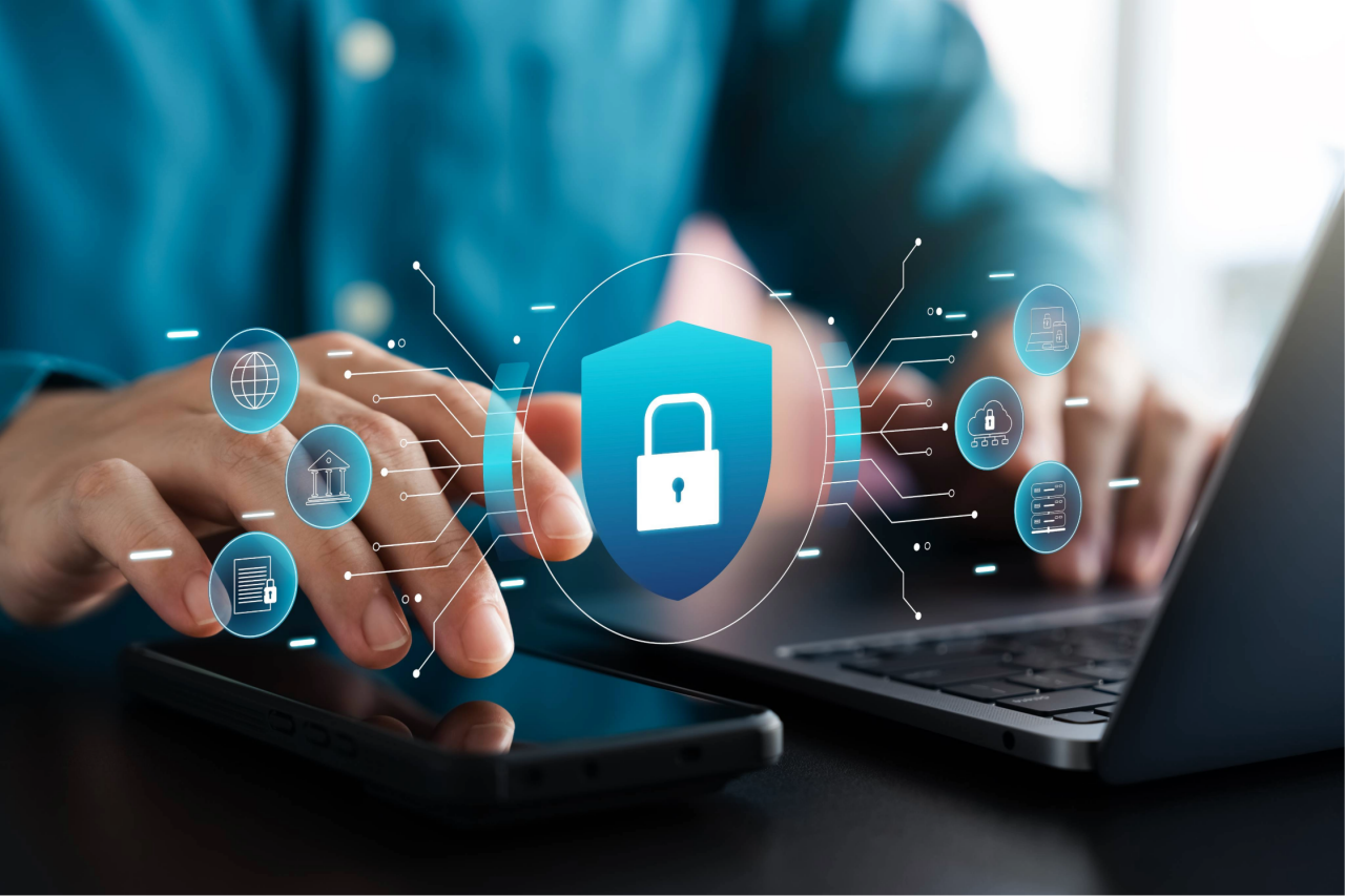 hands typing on a keyword with graphic of lock symbol superimposed