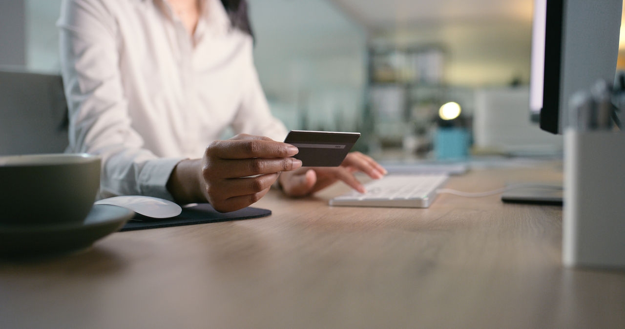 Hands, credit card and business woman with computer in office for sign up, ecommerce or payment closeup. Online shopping, zoom and lady accountant with sale, loan or survey, info or security pin