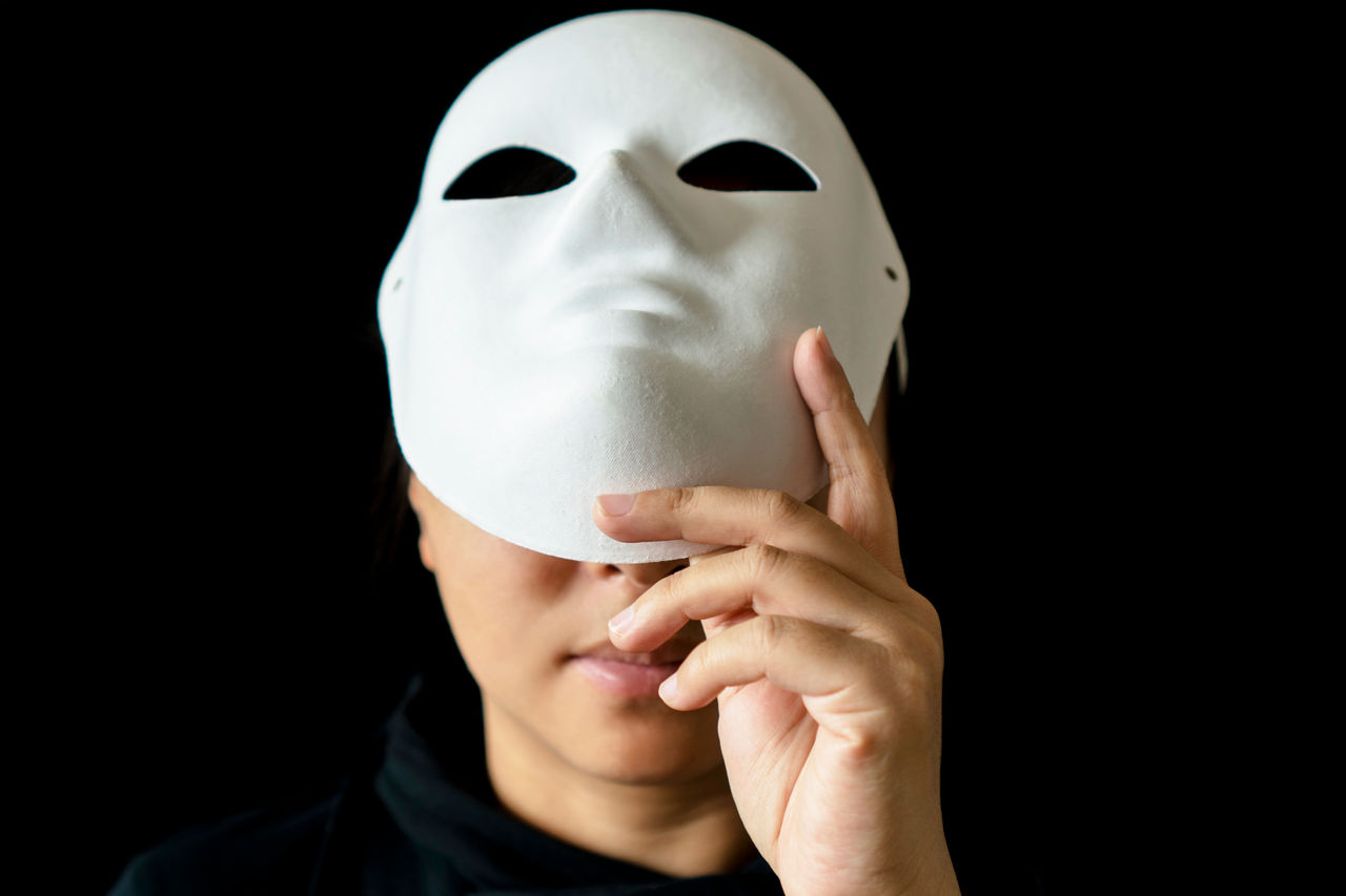 girl wearing mask in black backgrounds