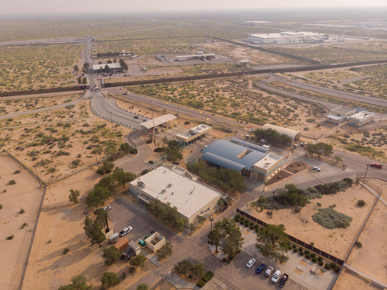 United States Mexico Border Aerial at Santa Teresa New Mexico and Juárez Chihuahua Mexico on a hazy Sunny late afternoon