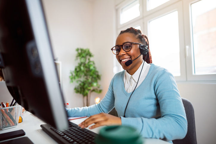 Customer support specialist working at her office.