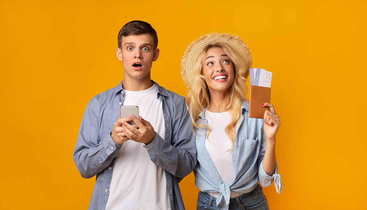 couple traveling with tickets in hand