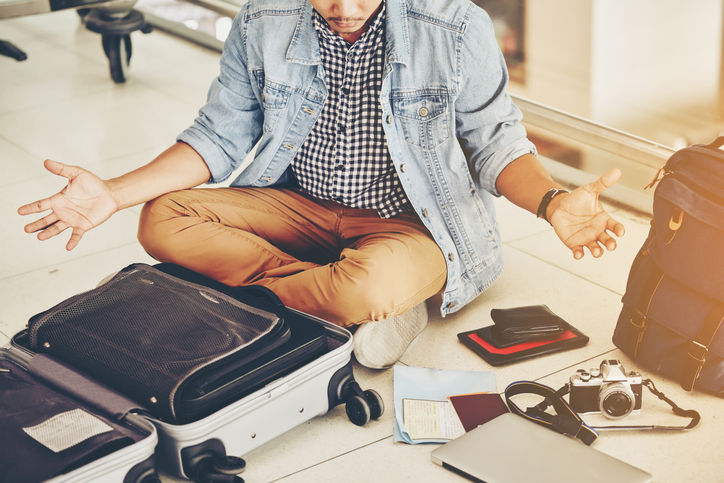 An Asian male traveler is experiencing the problem of need and lost value at the airport.