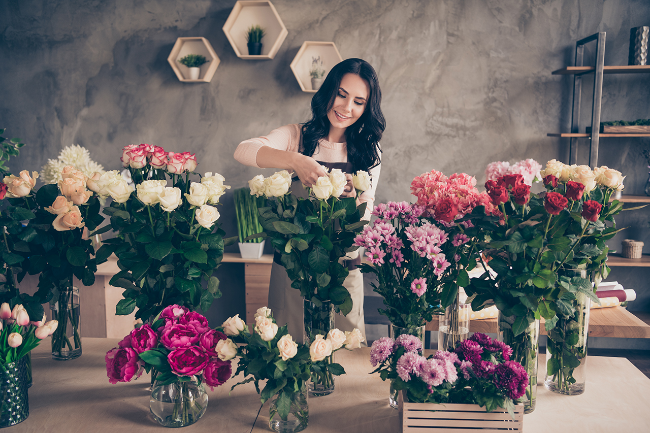 woman arranging flowers