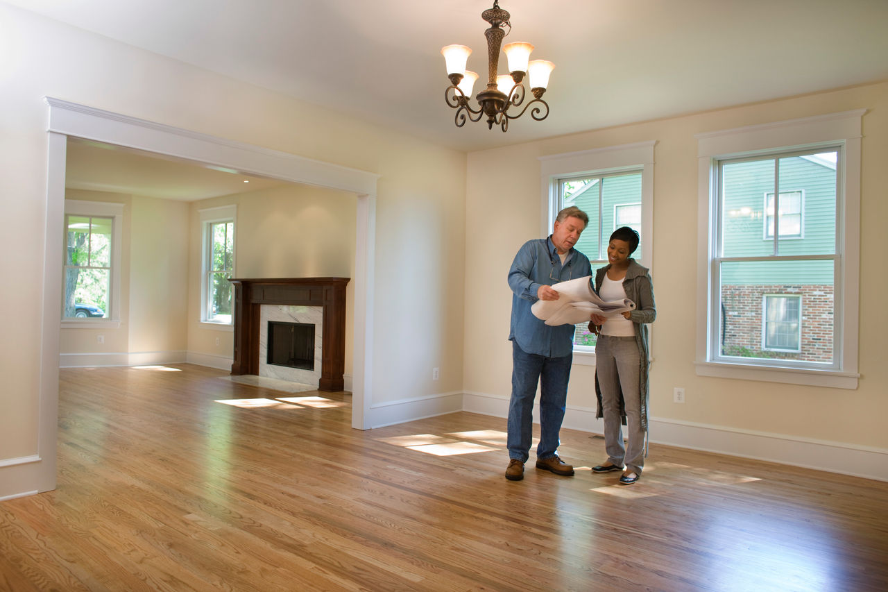 Contractor discussing renovations - stock photo