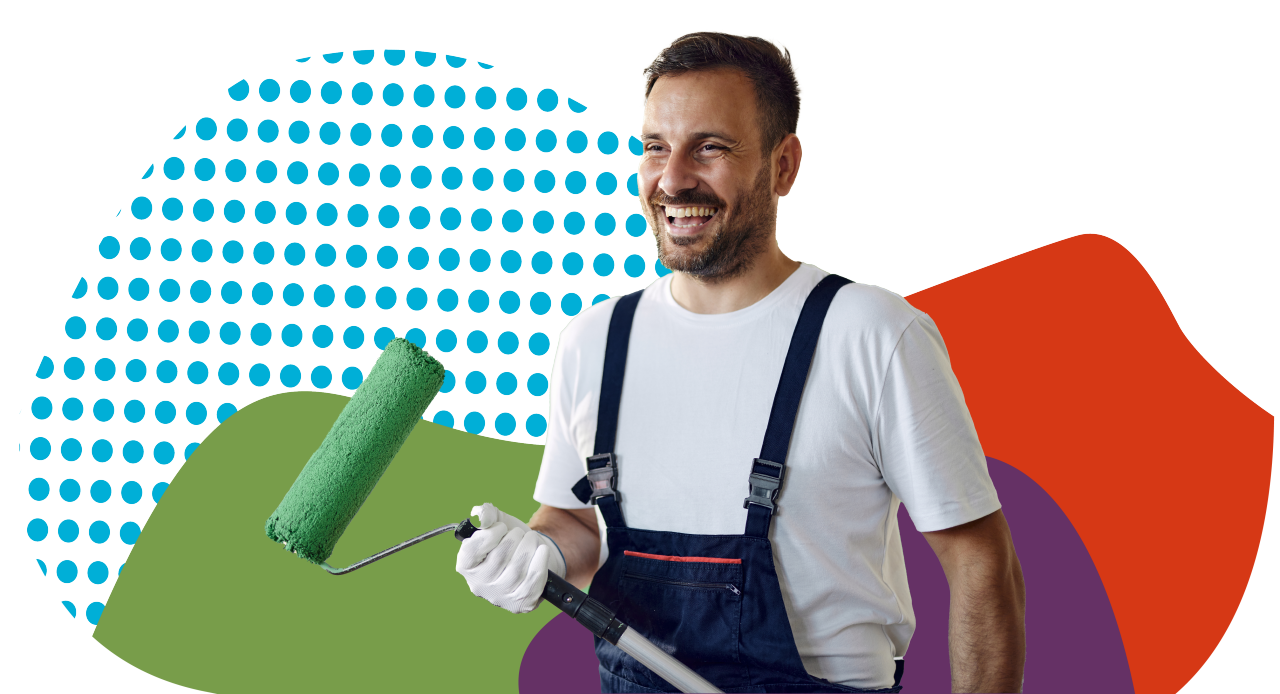 white male smiling holding paint roller