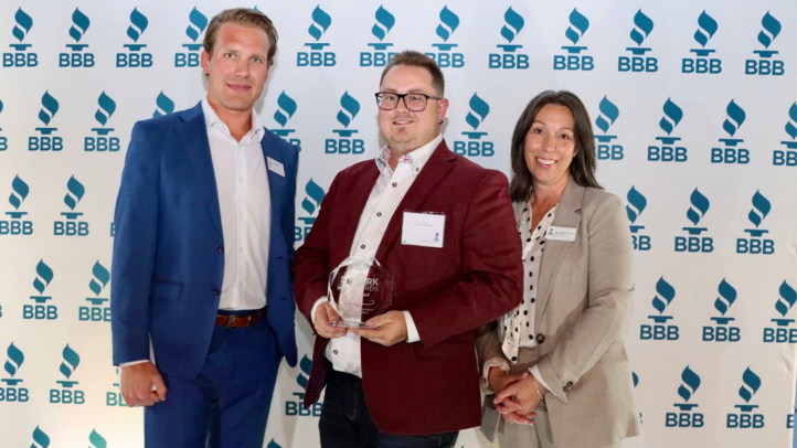 TOPP Kids Out of School Clubs Foundation smiling with award