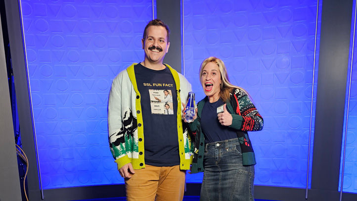 Owners of Security Shutter with 2024 Torch Award giving a thumbs up