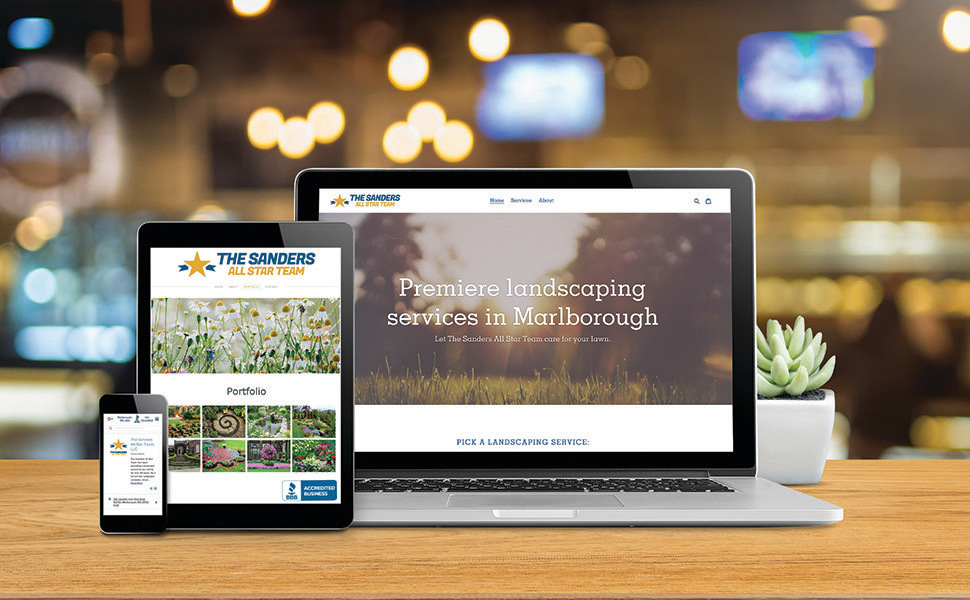 3 computer screens on a desk