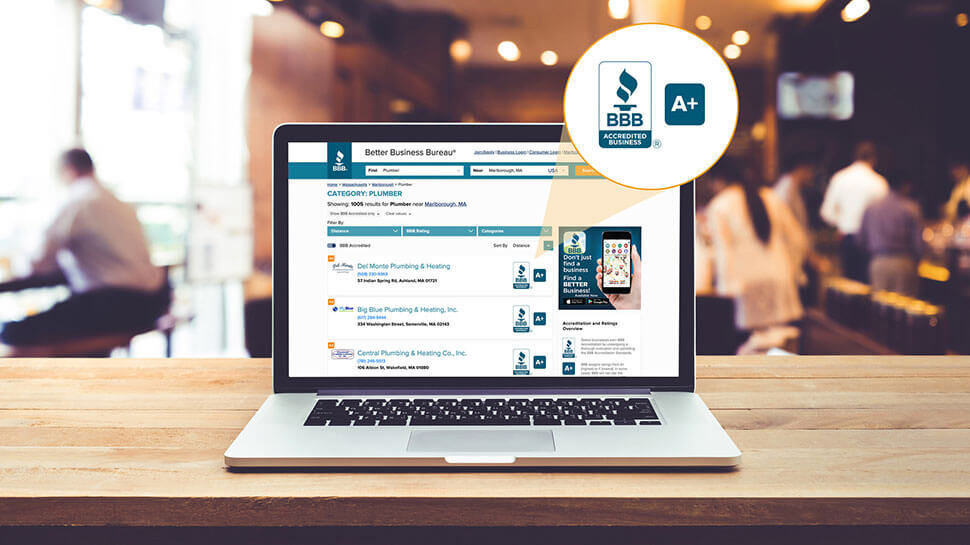 Laptop sitting on desk with search results on BBB website