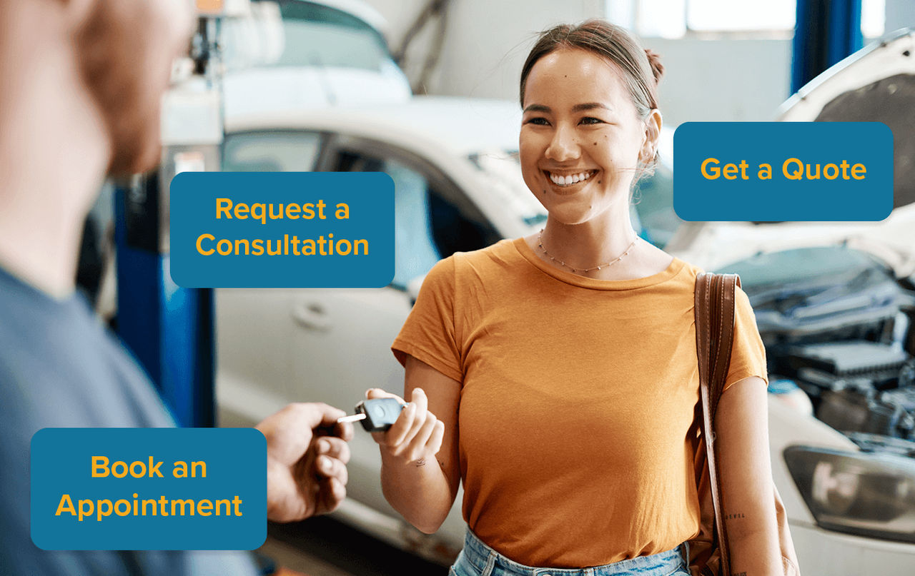 Woman at auto mechanic being handed keys