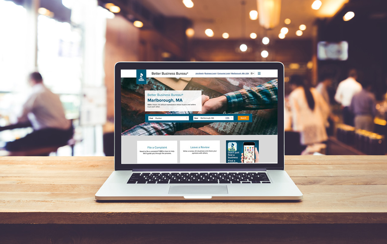 Image of BBB website on a laptop in an office