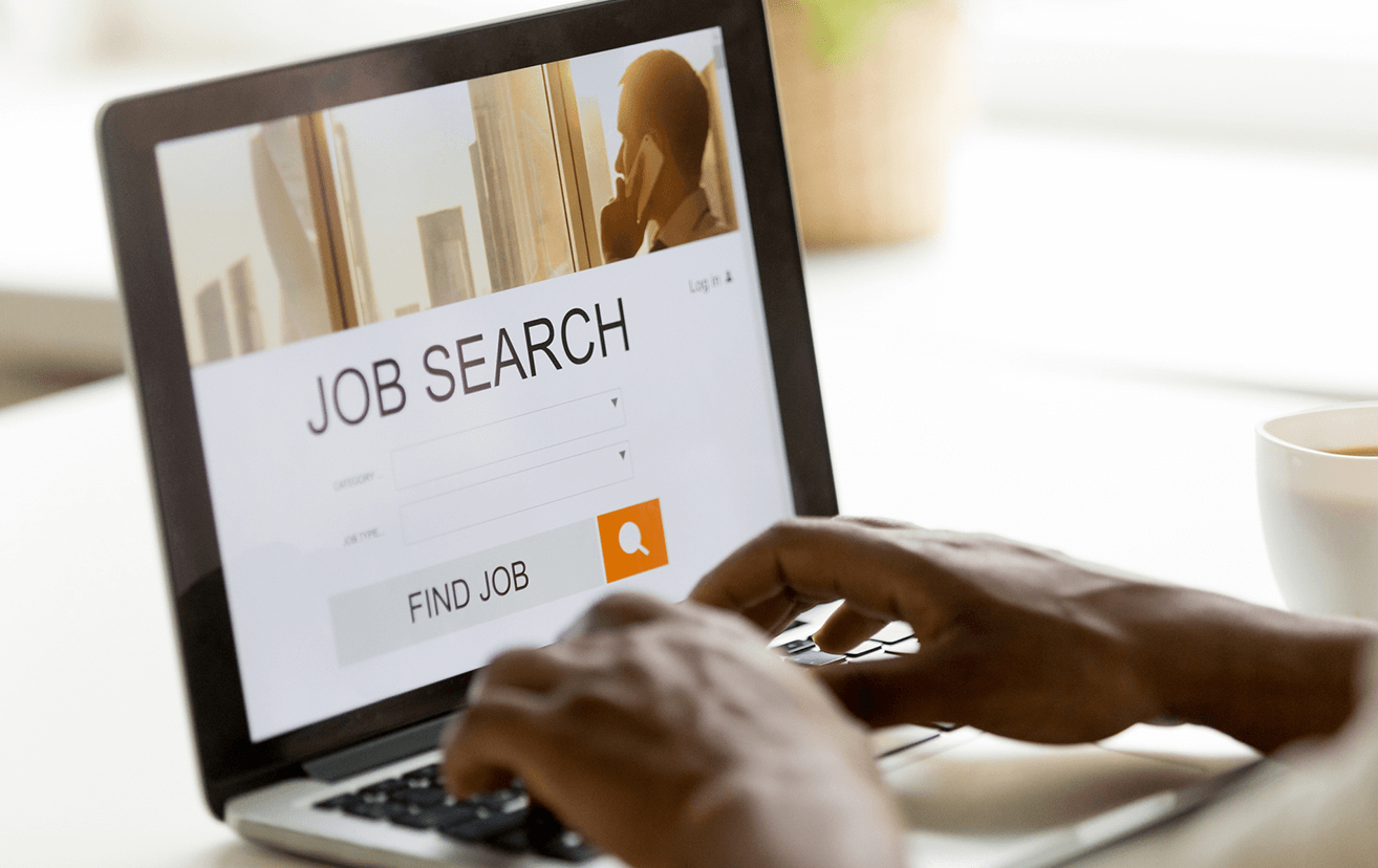 Person searching for a job on laptop