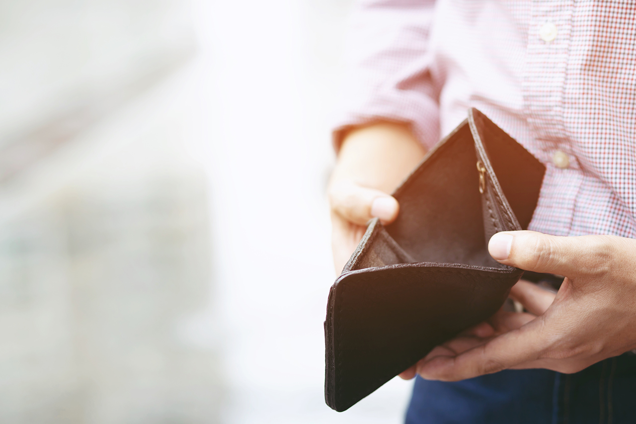Empty wallet (no money) in the hands of an man. Cost control expenses poverty   in concept