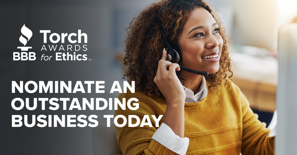 Torch Awards Logo Image - Small Business Owner Smiling with Team Members