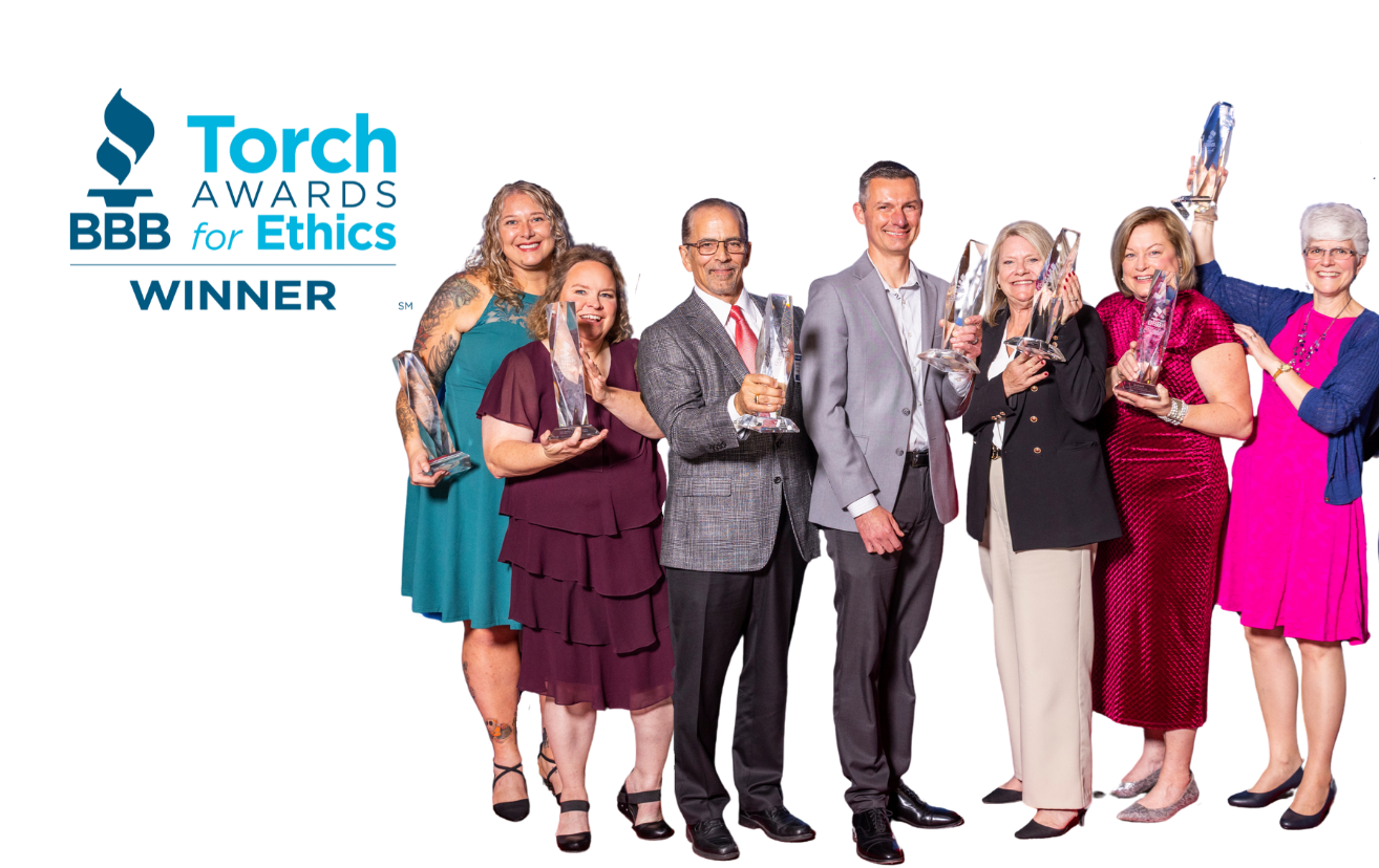 2025 Torch Awards winners holding awards