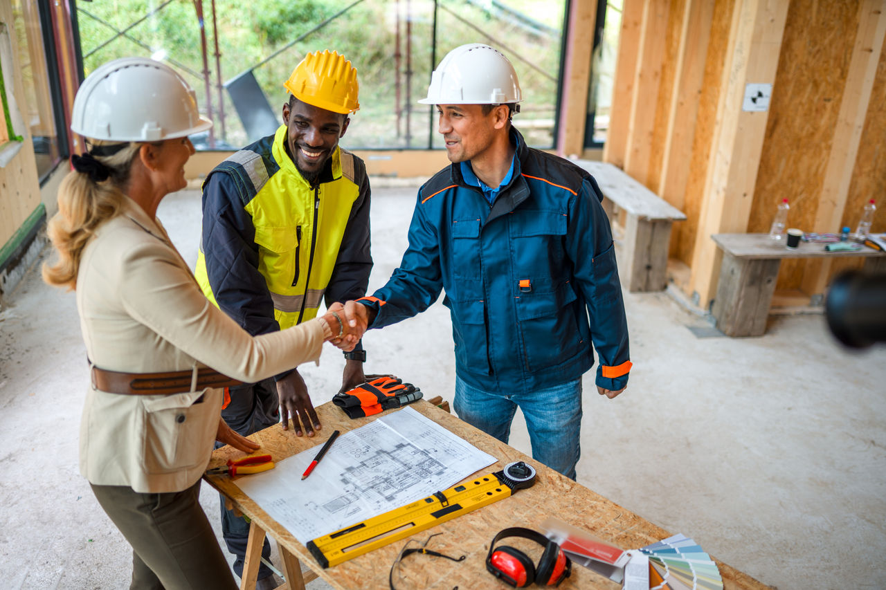 construction workers shaking hands