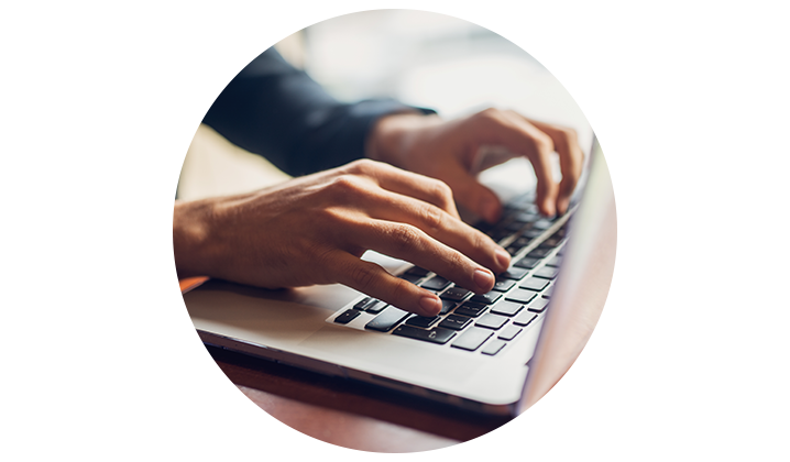 hands on laptop keyboard