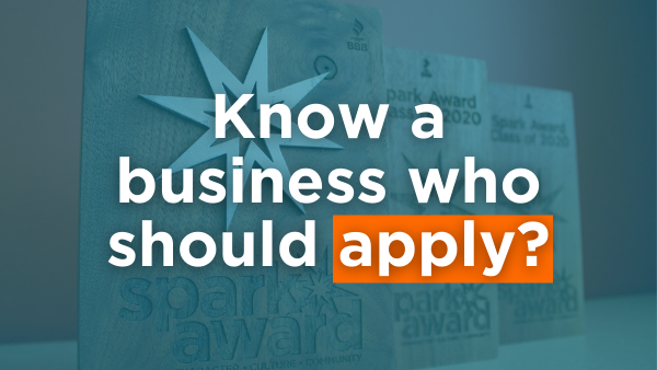 Three wooden Spark Award plaques with blue overlay and text: "Know a business who should apply?"