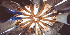 Large group of woman holding hands. Low angle view.
