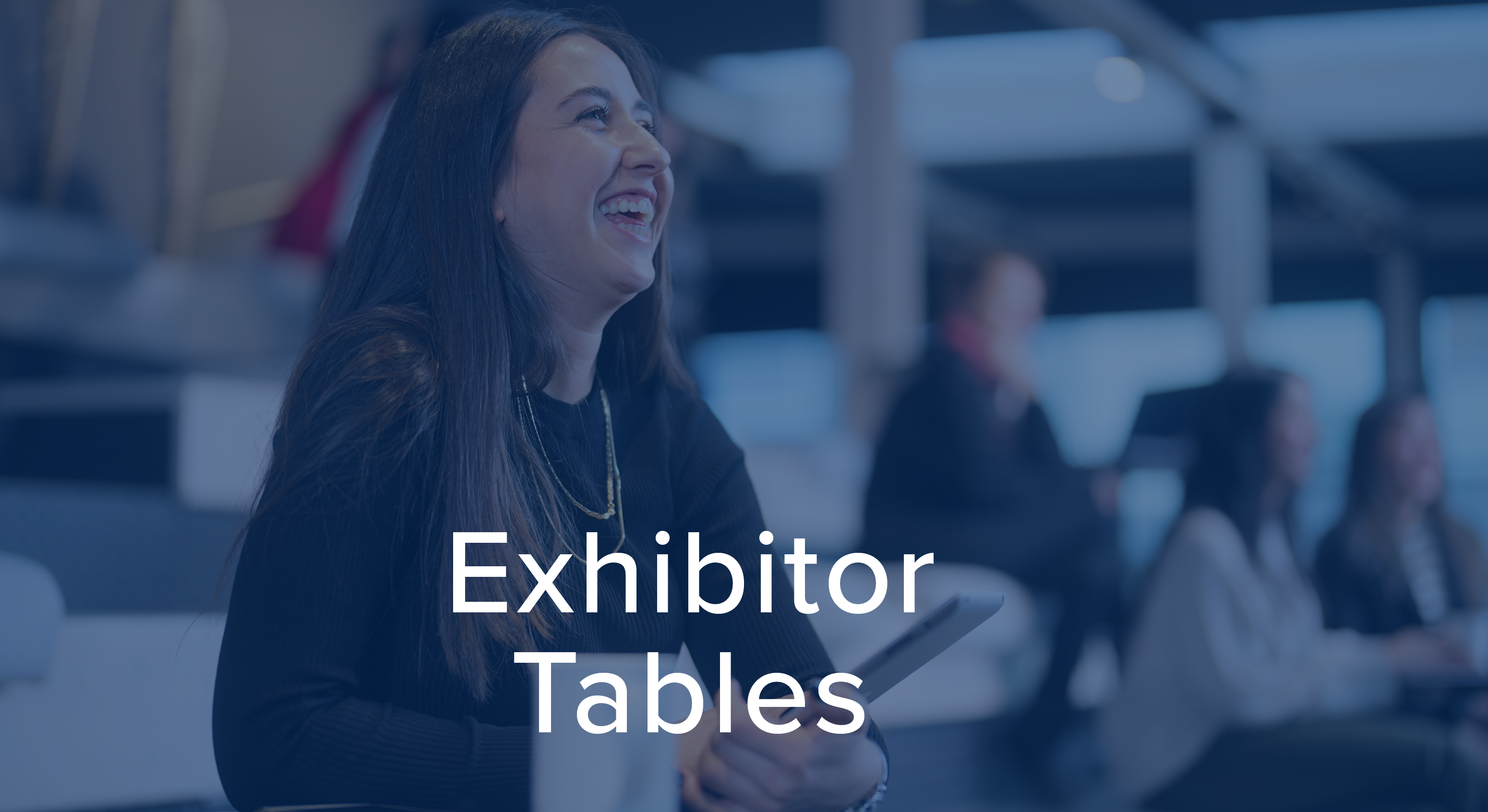 Smiling woman holding an iPad