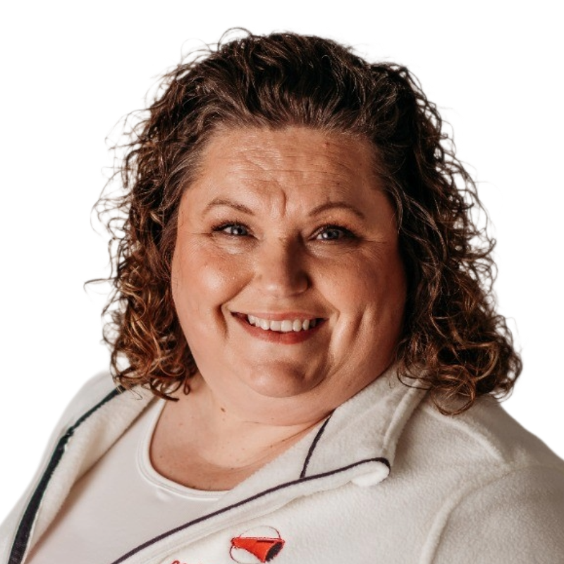 smiling woman with light brown curly hair in a white fleece sweatshirt