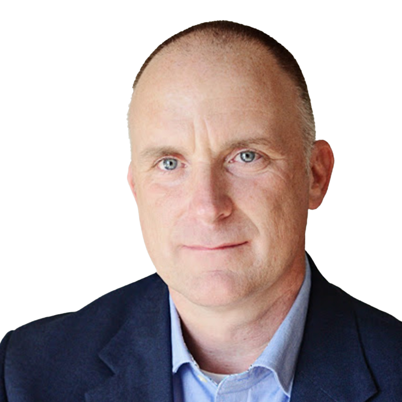 Man with very short hair blue eyes wearing a navy-blue suit coat and light blue shirt