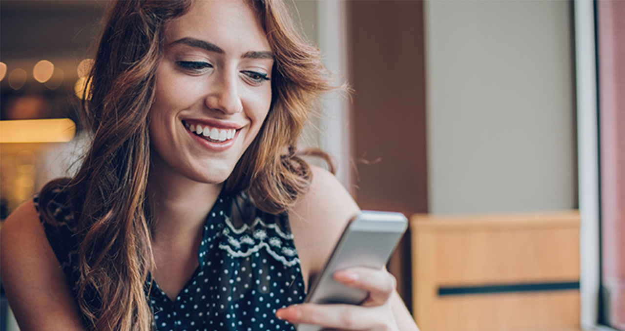 Woman on her phone with "get a quote from a BBB accredited business" written beside her, along with the BBB accreditation seal.