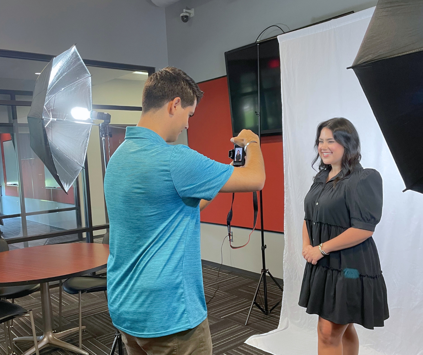 BBB photographer taking a headshot photo for an individual.