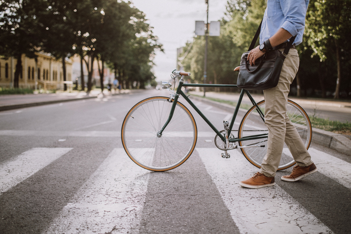Businessman with bicycle in the city