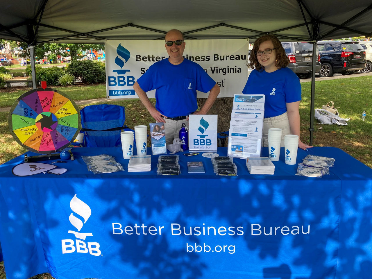 Former BBB Serving Western VA employees Sarah Lutz (right) and Chris Runyon (left) stand at the BBB both for the Summer Reading Grand Finale hosted by the Campbell County Public Library system.