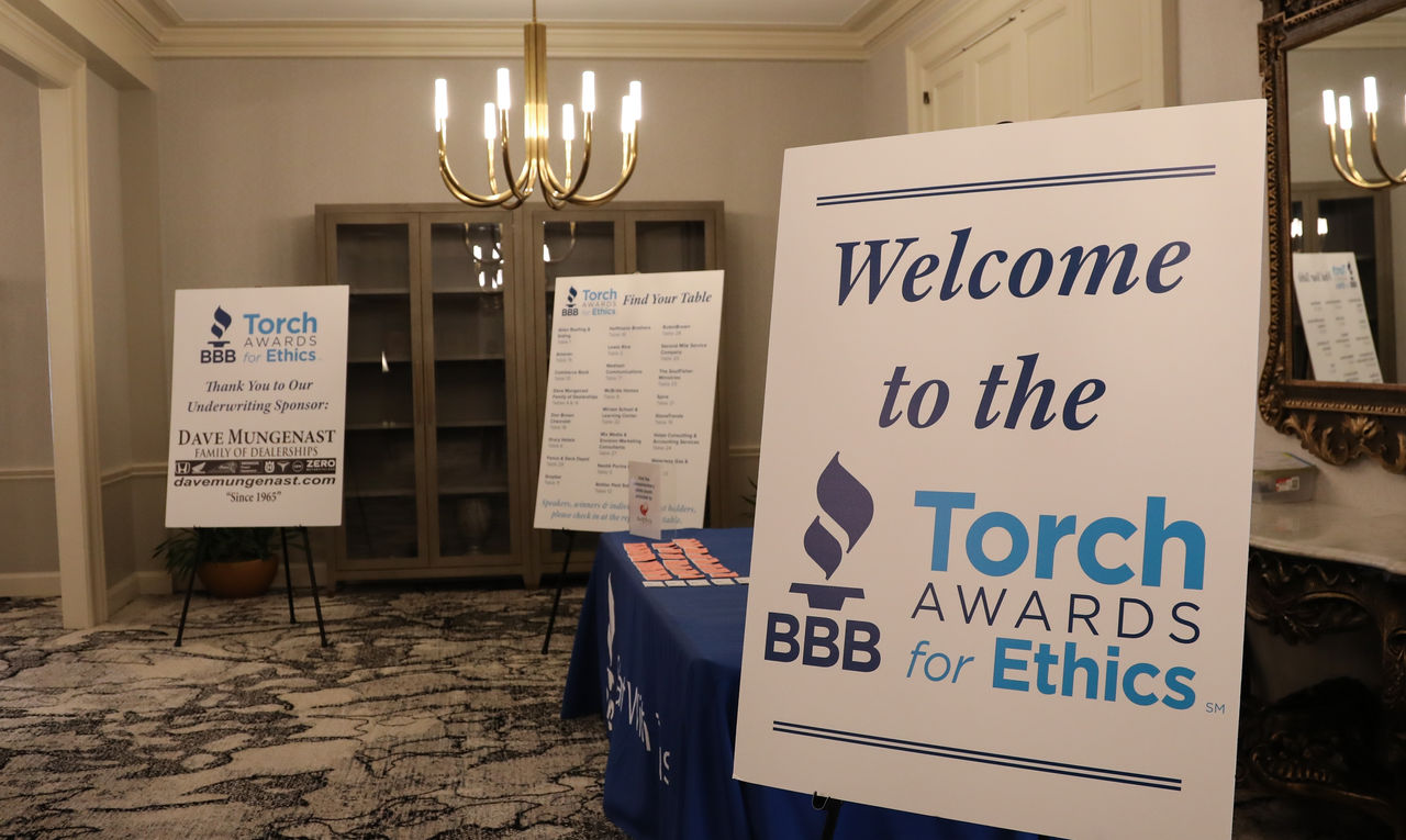 become a sponsor written on business card