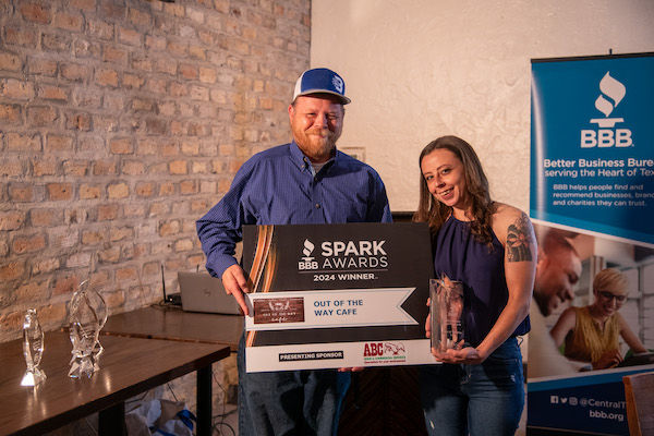 Group picture holding a spark award