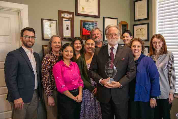Group picture with a torch award