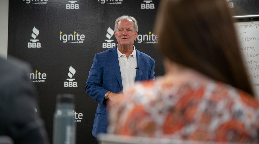 White male speaking in front of audience at Ignite Center.