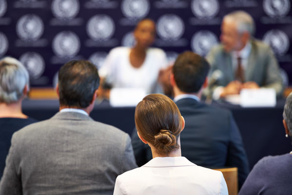 Shot of a group of businesspeople in a press conference