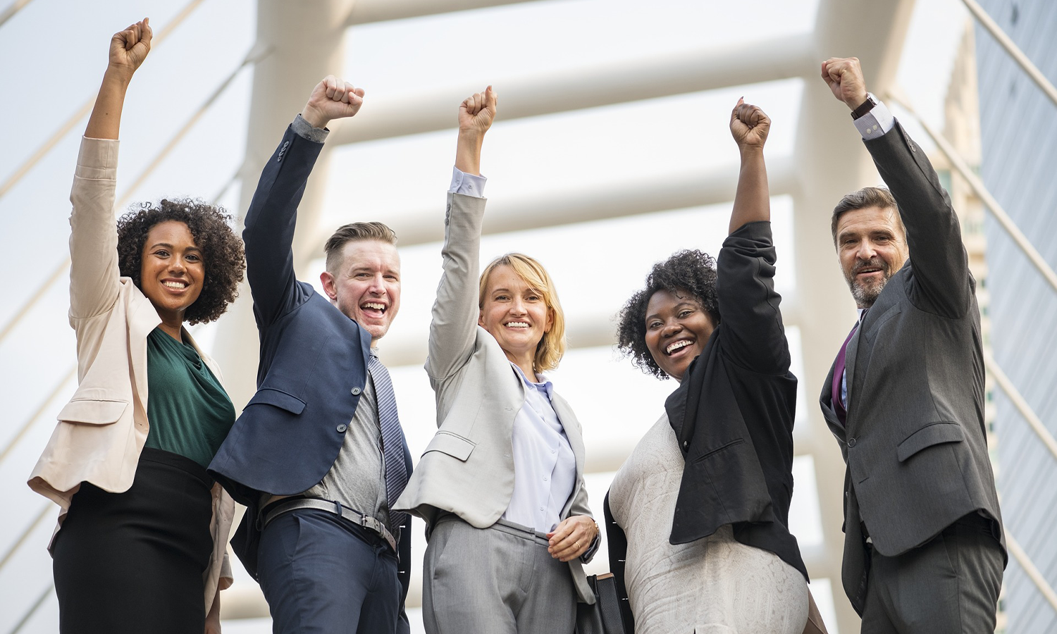 photo of people with raised fists in celebration