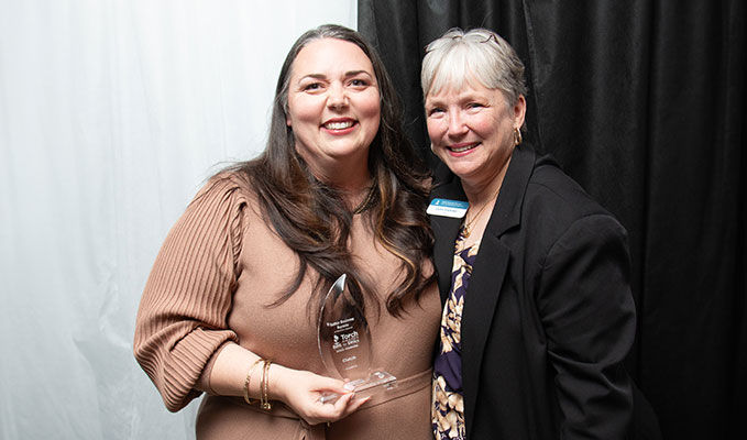 Picture of Better Business Bureau CEO Lynn Conner and Torch Award Winner Clutch