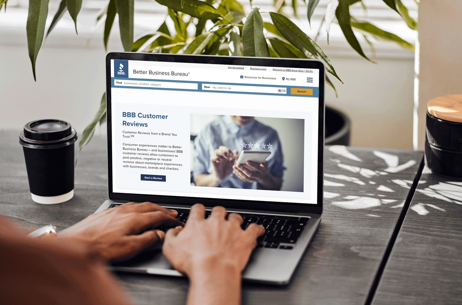 Laptop open to BBB Customer Review webpage.