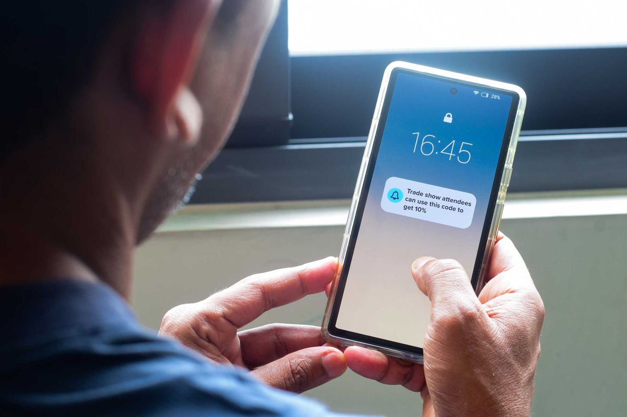 person receiving notification on smartphone
