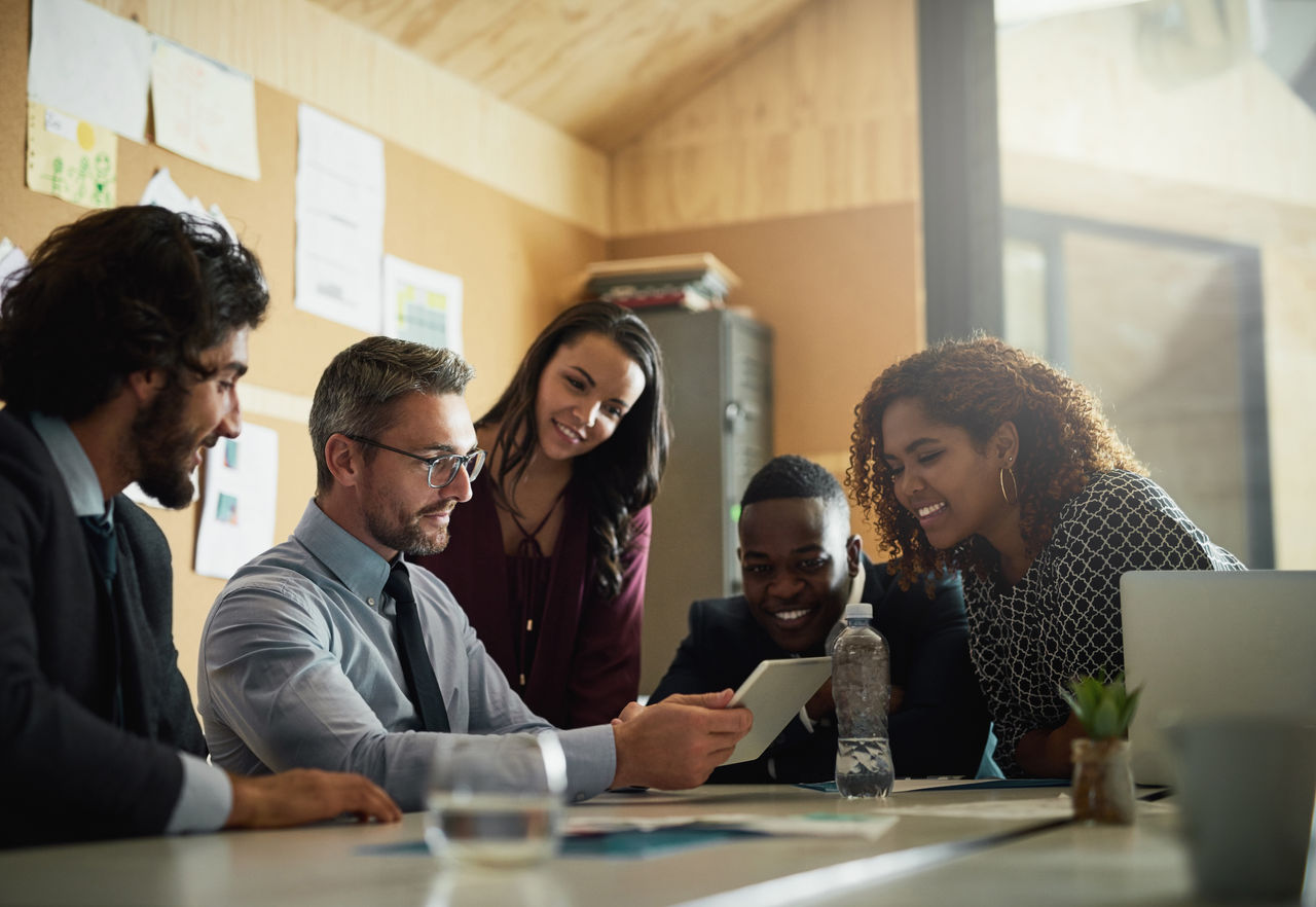 Cropped shot of a group of coworkers having a meeting in the office to discuss ideas and future business propositions